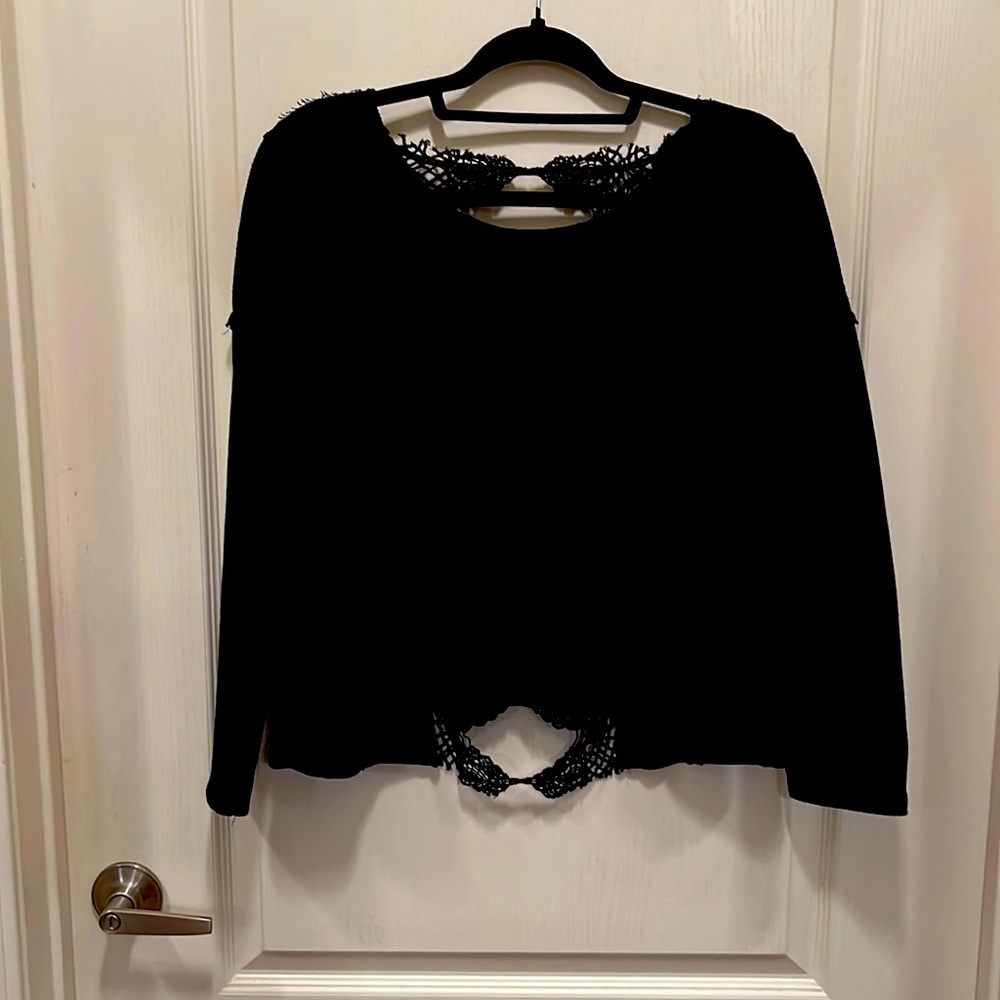 Black crop top open lace back ragged hemmed top.